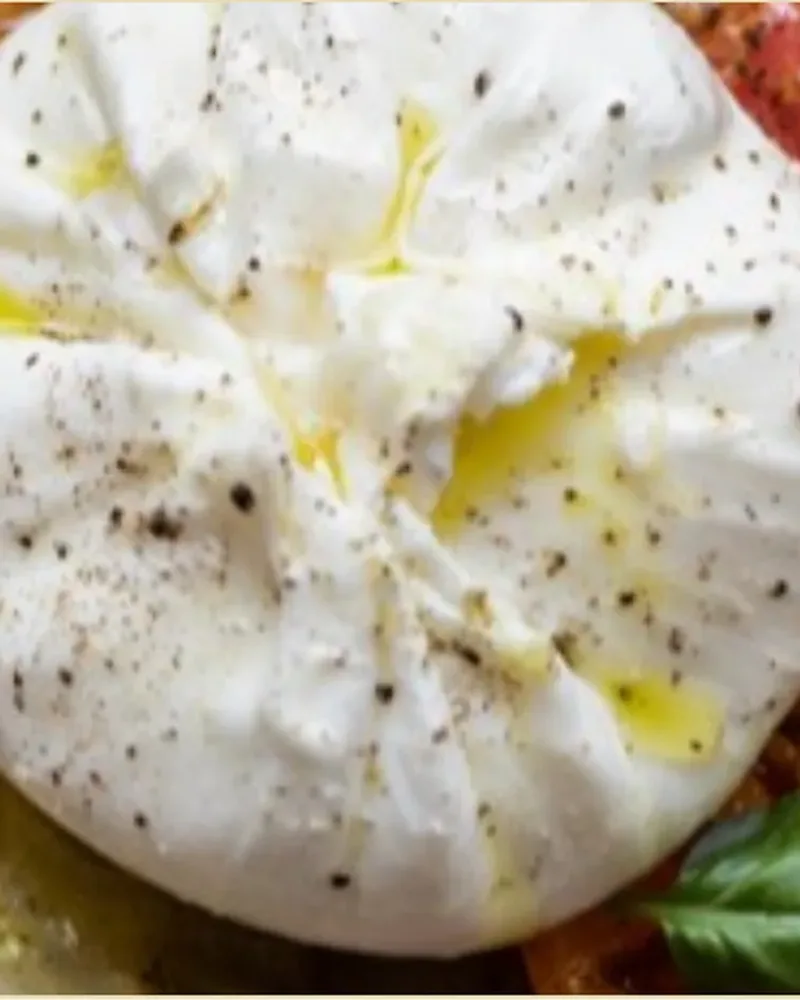 Burrata drizzled with olive oil and cracked pepper