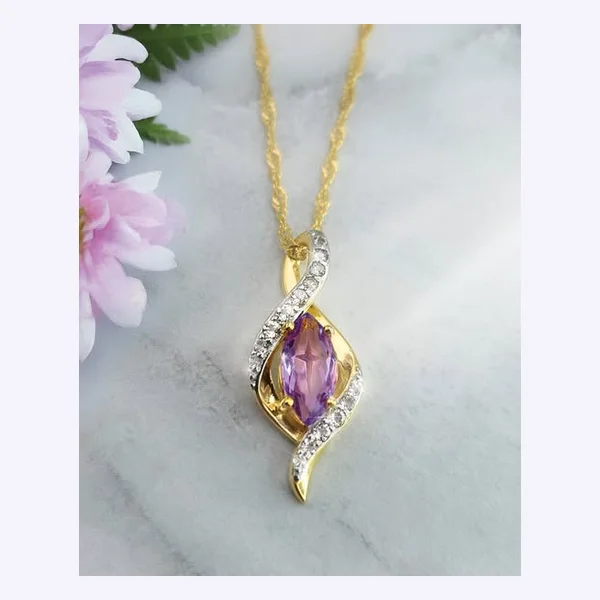 Static Meta ad: an amethyst pendant on marble