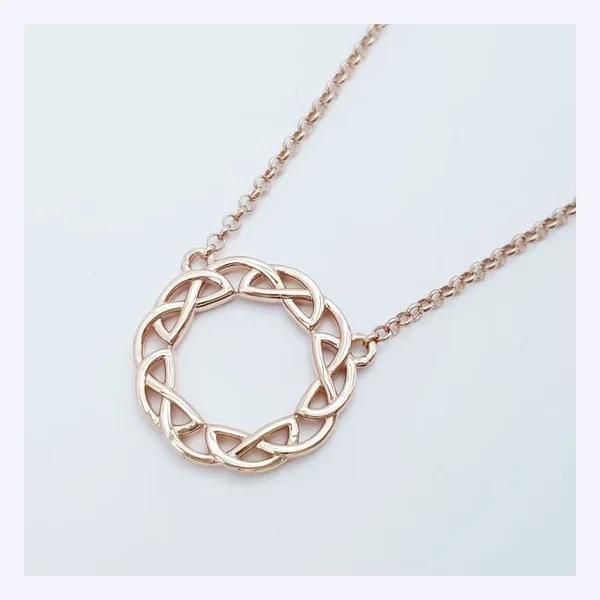 Static Meta ad: a rose gold necklace on a pale background