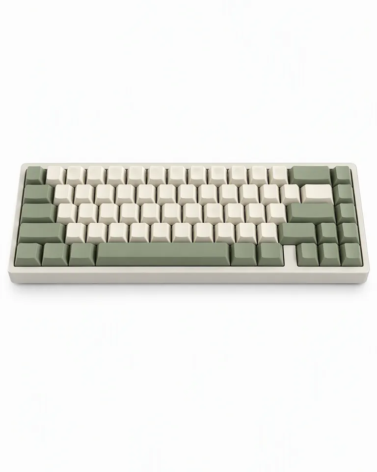 Teclado mecánico inalámbrico compacto con teclas crema y verde salvia sobre fondo blanco