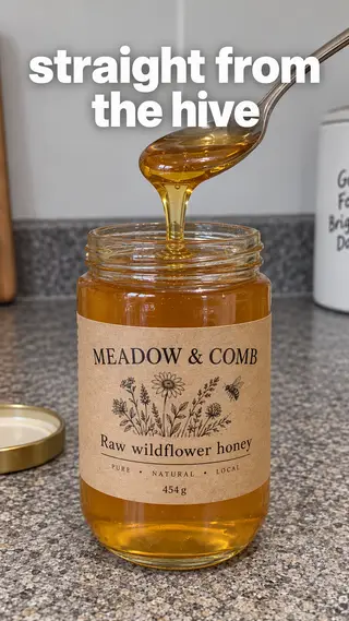 Instagram Story with "straight from the hive" written across it: a spoon lifting golden honey out of the Meadow & Comb jar