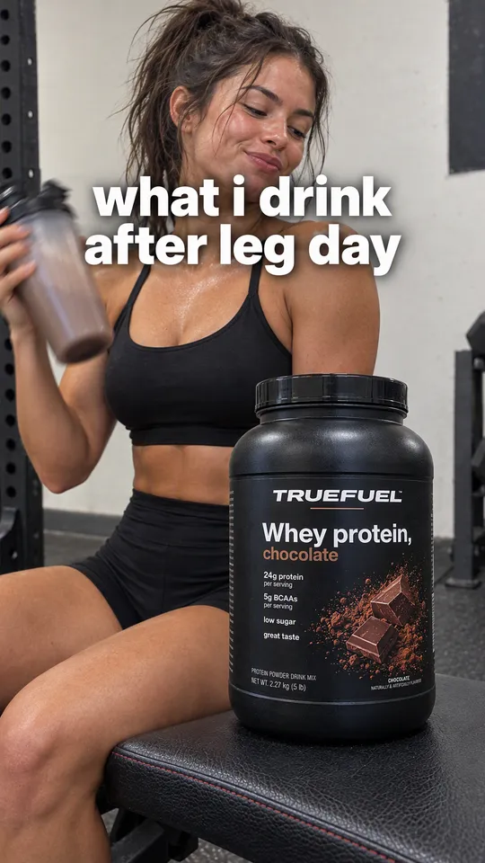 TikTok with the hook "what i drink after leg day": a woman shaking a shaker with the Truefuel protein tub on the gym bench