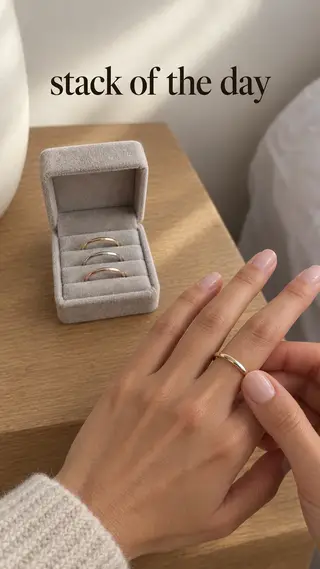 Instagram Story with "stack of the day" written across it: a woman sliding one of the rings onto her finger